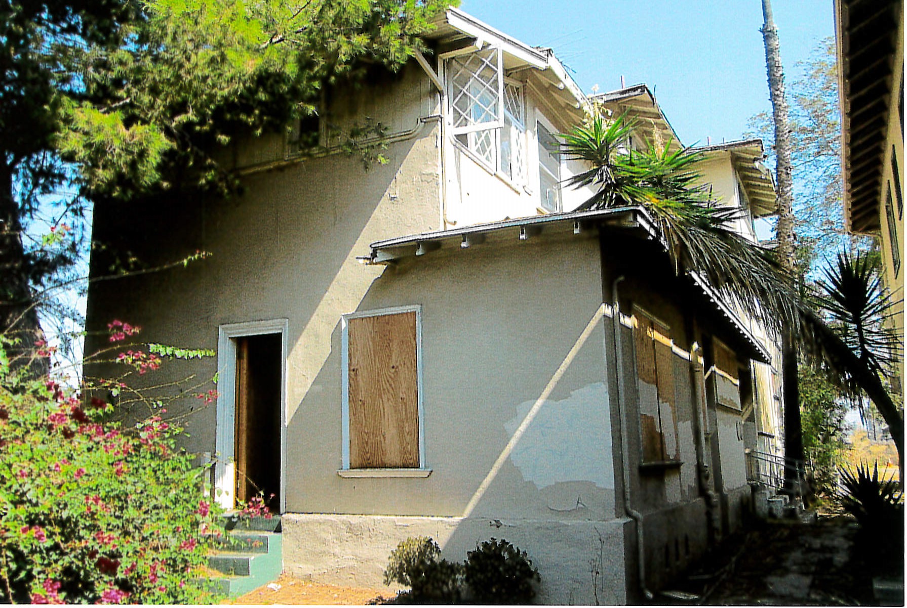Exterior view of boarded up building 
